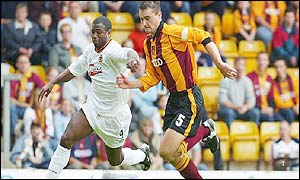 Wolves' Nathan Blake tussles with Bradford's David Wetherall