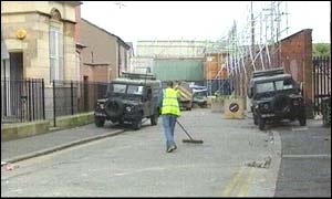 Workers clear up after another night of violence