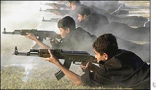 Iraqi schoolboys practise firing assault rifles