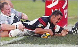 Daryl Gibson grabs a try for Canterbury against the Sharks in Durban, April 2002.