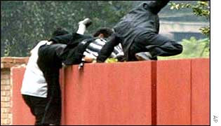 North Koreans scale the school wall