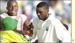 Chris Gayle is mobbed by fans