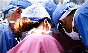 Surgeons in operating theatre