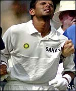 Dravid is helped from the field