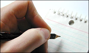 Hand holding pencil