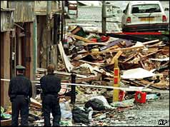Police survey the devastation caused by the Omagh bomb in August 1998