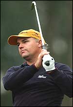 Stephen Dodd watches his approach at the 18th durng his third round