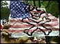 Chinese hold up defaced American flag