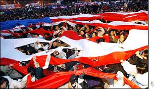 Protesters tear apart a huge US flag in Seoul
