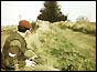 A soldier detonates a controlled explosion on a border road