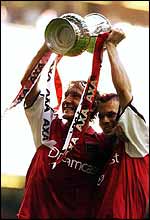 Ray Parlour and Freddie Ljungberg hoist the FA Cup