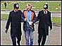 Picket flanked by two police officers