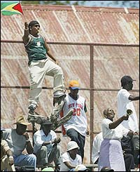 West Indies fans wave flags to get behind their team