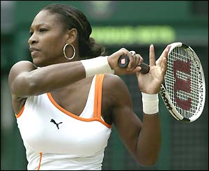Serena Williams hits through a forehand