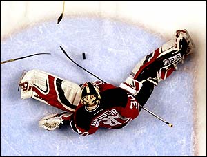 Martin Brodeur of the New Jersey Devils makes a save against the Philadelphia Flyers in their 3-2 win at the Continental Airlines Arena in East Rutherford, New Jersey
