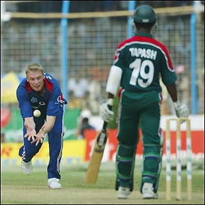 Andrew Flintoff catches and bowls last man Tapash Baisya