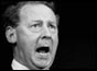 Hugh Gaitskell speaking at microphone