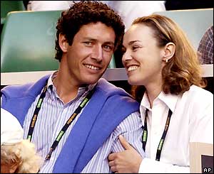 Martina Hingis and friend watch from the stands