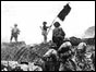 Viet Minh soldier waves flag after victory at Dien Bien Phu