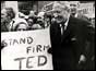 Mr Heath and campaigner holding stand firm Ted poster 