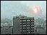 Baghdad tower block with flames behind