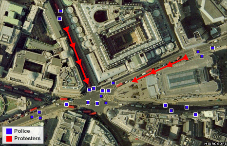 Protesters begin to gather from roads to the north and east, and are guided towards a central location by police.