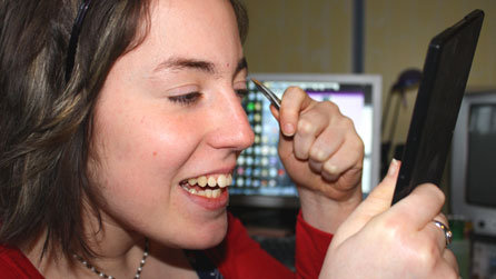 Careful with those tweezers! Nicola tackles her eyebrows first, beginning the intricate procedure with her left eye