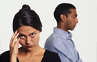 Abusive relationship (Image: upset woman with man turned away in background)