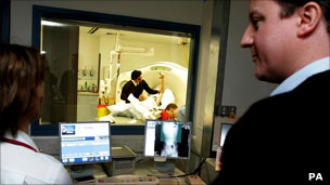 David Cameron watching X-ray examination in hospital