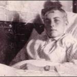 Jack sitting up in his hospital bed, probably on or about 21st May 1944. You can see the scar on the left side of his head, showing where the incision was made to remove the bullet.
