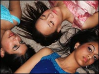 Women in Asian dress.