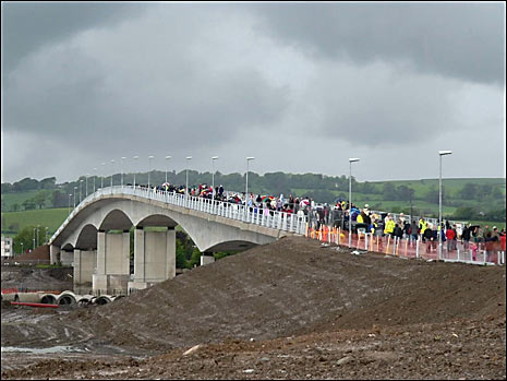 Residents celebrate the completion of the bridge