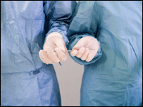 surgeons pass instrument at operation