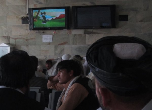 Watching Tom and Jerry in a departure lounge at Kabul airport