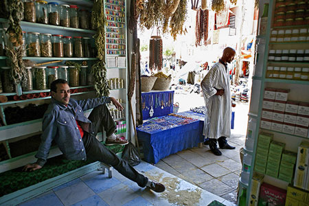 Two men in a shop, photo by Tom Ang