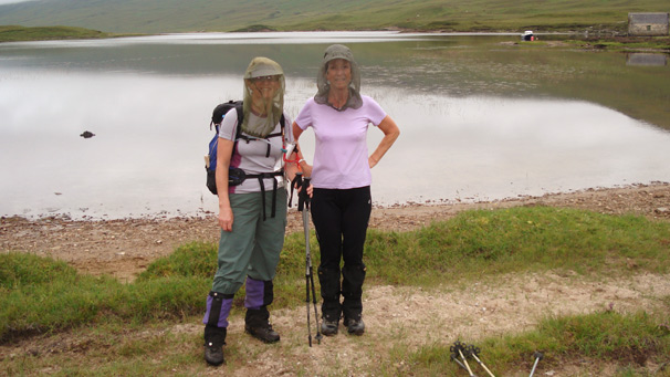 Two women standing at a lake near Ullapool