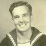 V.A.J. Hurley taken in Falmouth during the war years. The flags on the right arm represent signalling. The stripe on the left arm is for 3 years good conduct and on the lower left arm (just out of picture) a silver minesweeping badge for 18 months hazardous minesweeping duties.