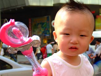 A wee baby with a Mohawk.