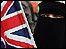 Muslim waving British flag - Matt Writtle/PA