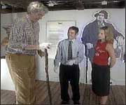 Chris Greener using Robert Hales' cane at the Time and Tide Museum