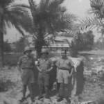 Written on the back of this photograph is "Taken outside the hangar we sleep in at Basra, 13/10/41". Wilfred Hill is on the left.