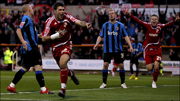 Charlie Austin (second left) in action for Swindon Town.