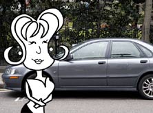 Alice standing outside a car