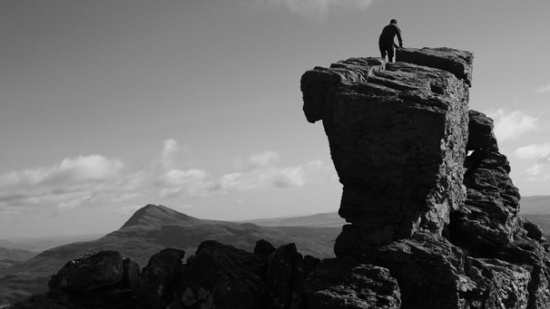 A person on top of the mountain known as 'The Cobbler'