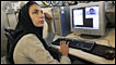 Iranian woman on a computer