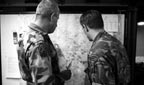 Soldiers looking at a map of the area.