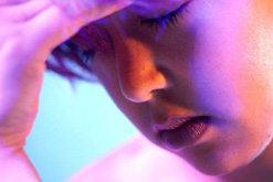 Image: woman with head in hands