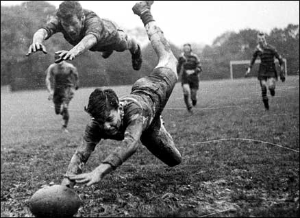 Playing rugby in the mud, 1960