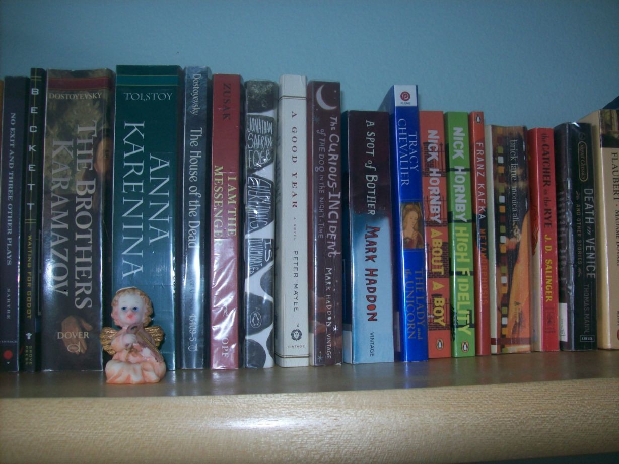 My books and my kitschy little angel.