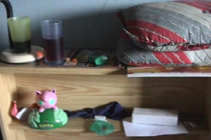 Tom's mum takes the camera into his bedroom while he is out